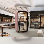 Framery One Premium Work Pod - framery one premium pink colour with user in it