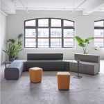 Allermuir Host tables in a lounge setting with grey modular sofas