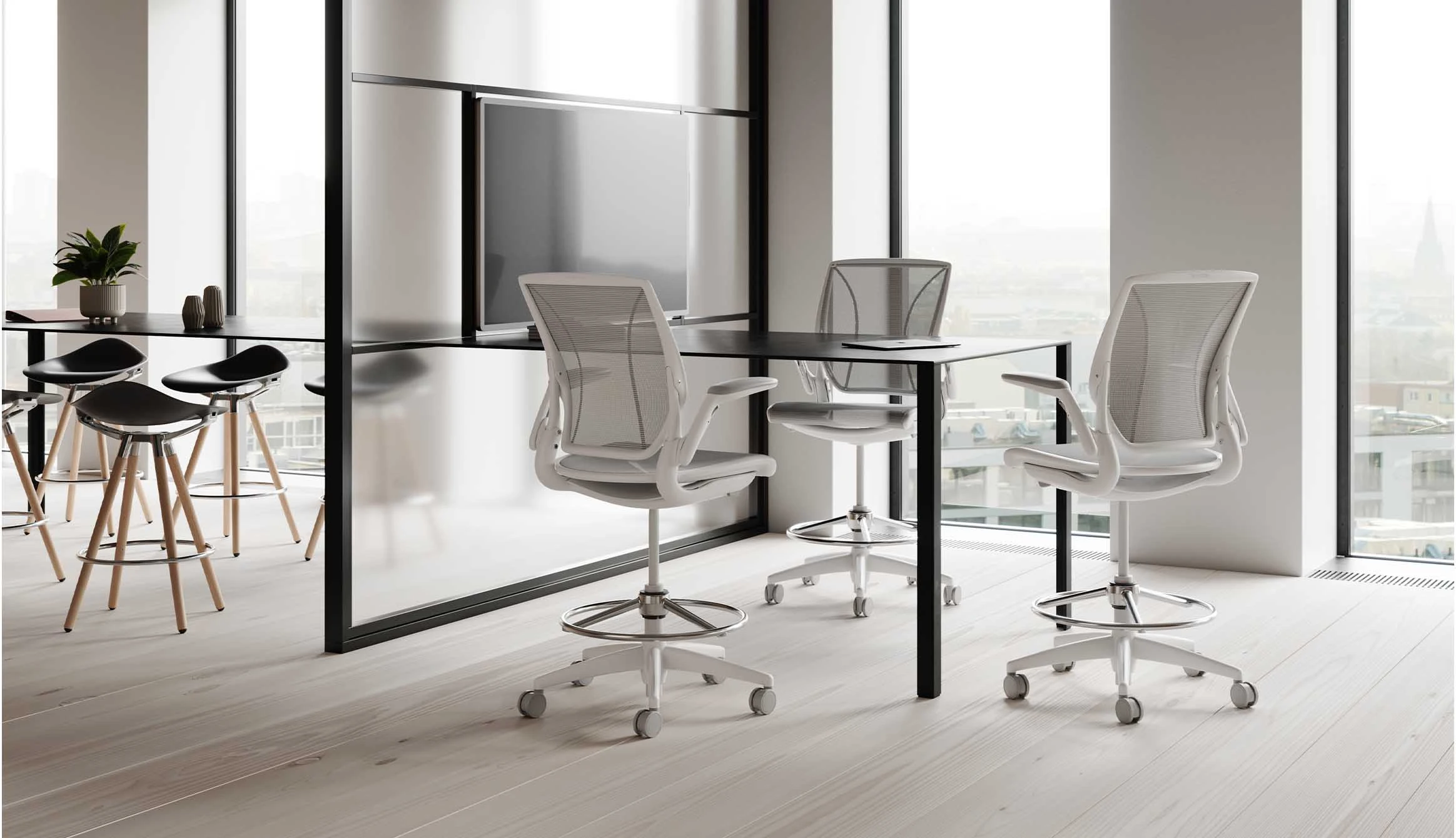 Humanscale ergonomic office chairs paired with a modern workstation in a contemporary office